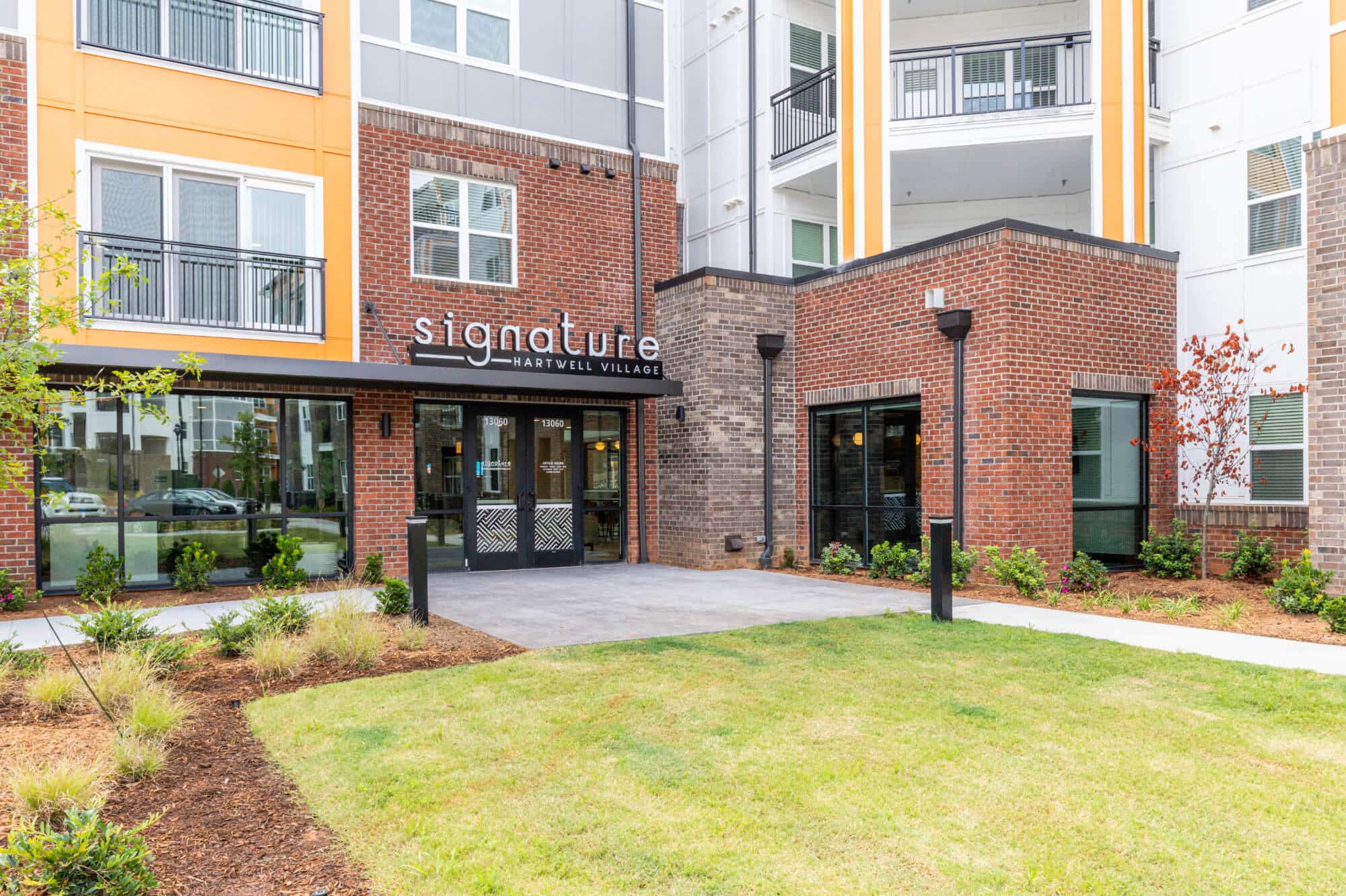 signature hartwell village off campus apartments near clemson university building exterior main entrance